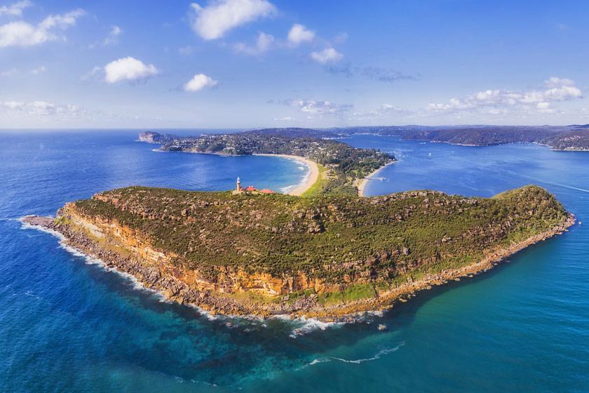 Barrenjoey headland and lighthouse above the turquoise water at Palm Beach