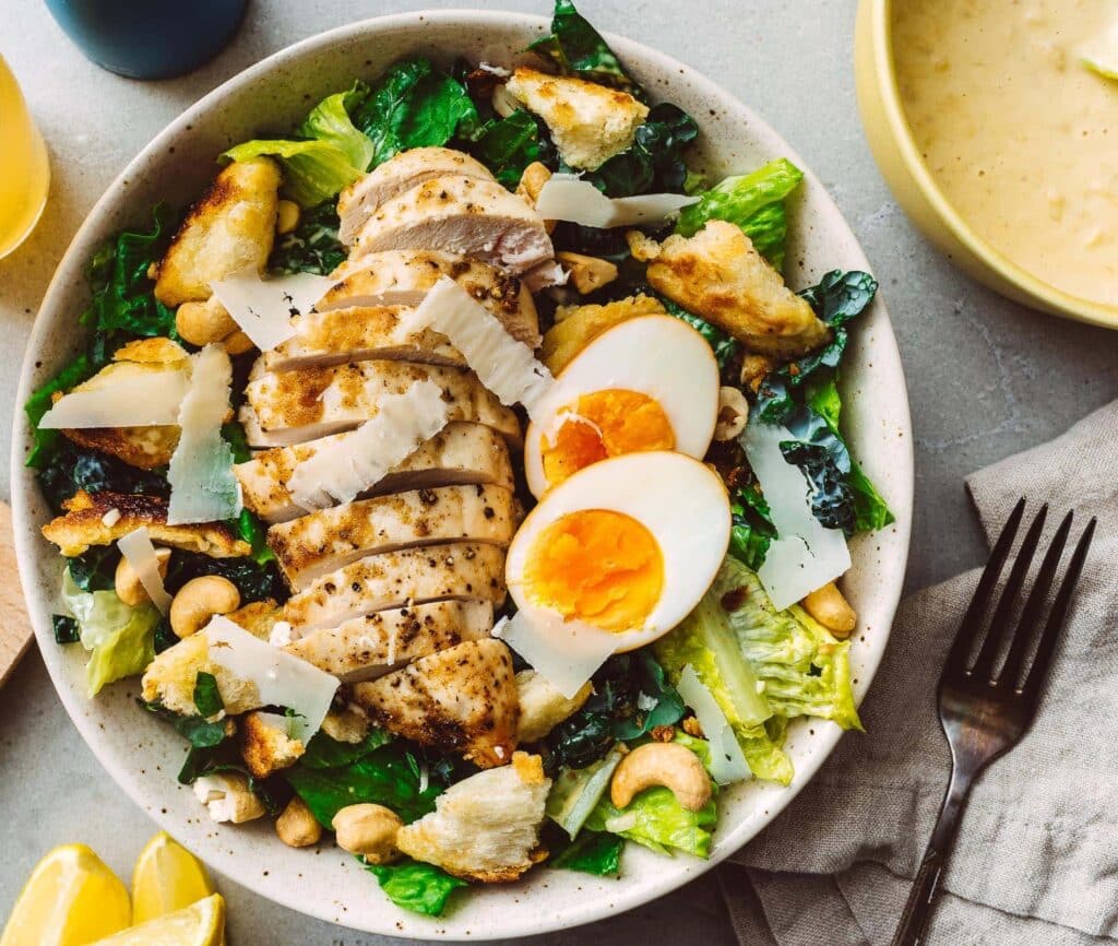 Chicken caesar salad with egg, bacon and parmesan